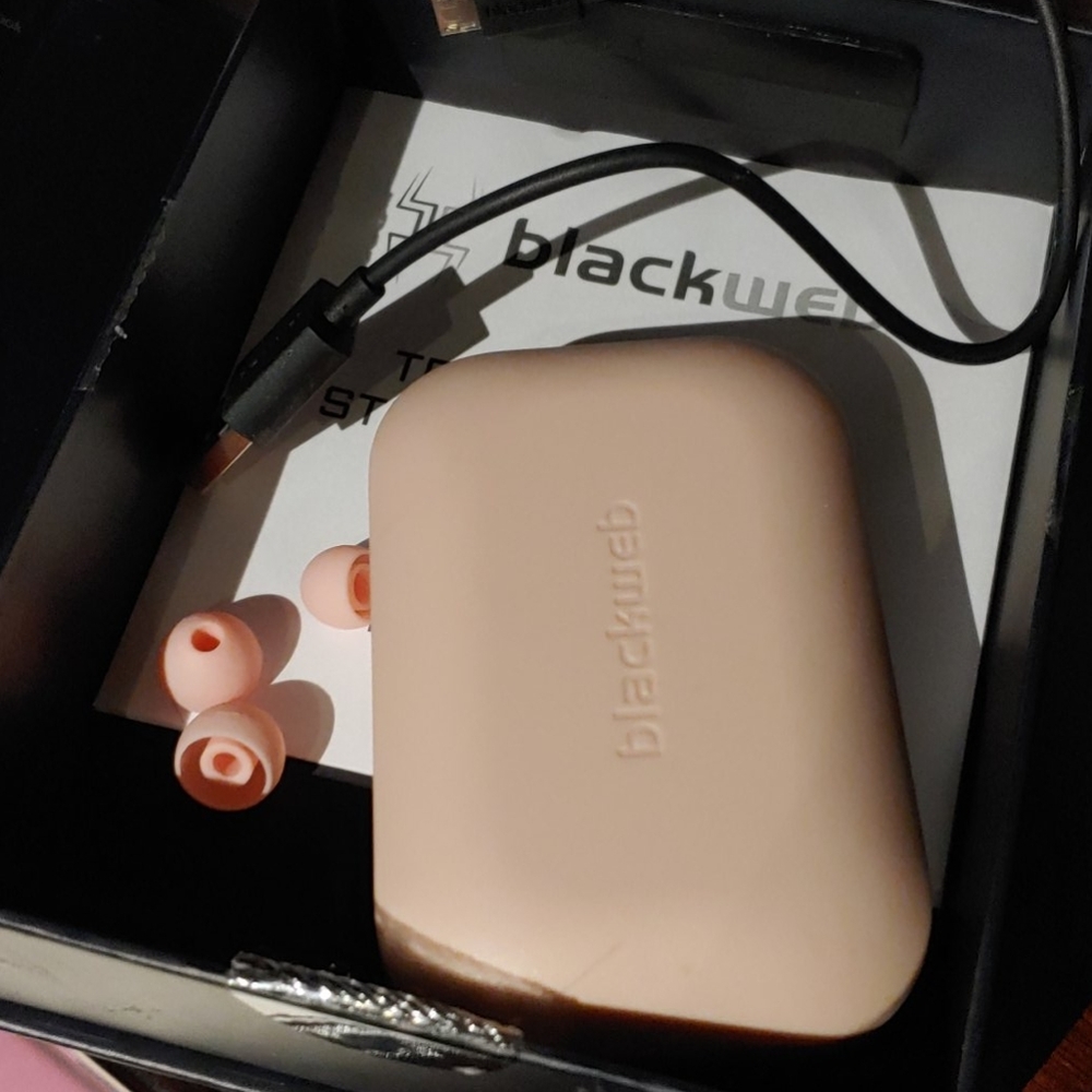 Blush pink earbuds